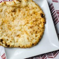 Cheese Naan · Naan bread stuffed with cheese and spices.