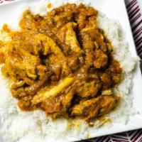 Chicken Curry · Boneless chicken thigh cooked with tomato, ginger, garlic, onion, and spices.
