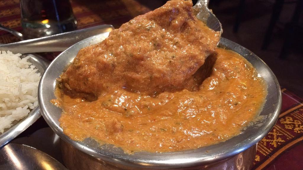 Fish Tikka Masala · Fish cooked with tomato, onion, ginger, garlic, and spices.