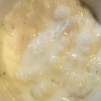 Kheer (Rice Pudding) · Basmati rice cooked in milk, sugar, coconut, and cashew nuts. (served cold).