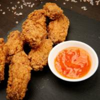 Original Chick'N Wings · Delicious Vegan Chick'n Wings, battered and fried to perfection. Served with a side of golde...