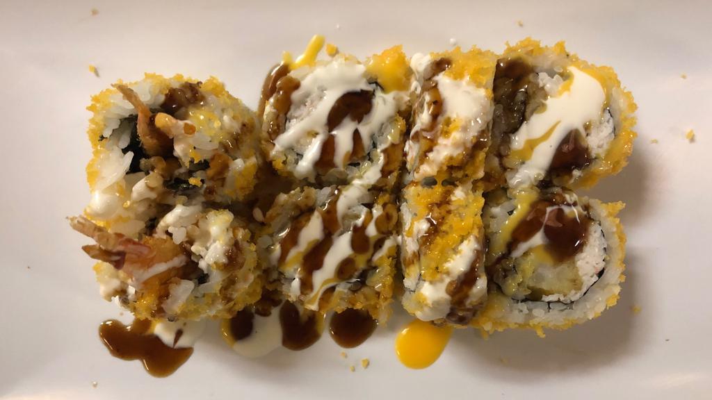 Crunch Roll · Shrimp tempura, cucumber, avocado topped with crunch tempura eight eel sauce.