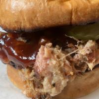 Pulled Sammie · Brisket or pork, pickles, and aioli with choice of sauce on brioche served with fries and sl...