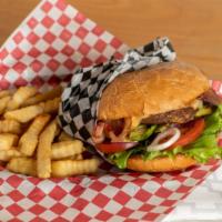 Hickory Bbq Burger W/Fries · 1/3 pounds of ground meat, Cheddar, bacon, onion ring, lettuce, tomato, pickles, bbq, and ho...