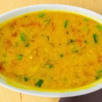 Yellow Tadka Dal · Dairy free, vegetarian, gluten free. Yellow lentils finished with browned garlic, cumin and ...