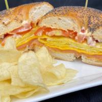 Smoke Em Sandwich · Bagel, lox, egg omelette, spicy mayo, red onions, and tomato.