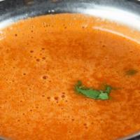 Basil Tomato Soup · Gluten free. A rich curried tomato soup spiced with basil, cumin, curry leaves and a touch o...