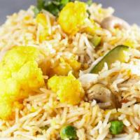 Royal Biryani · Vegan, gluten free. A classic mughlai dish of basmati rice cooked with curry, green peas, ra...