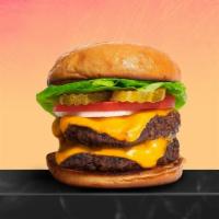 Cheesy Double Decker Burger · Two American beef patties topped with melted cheese, buttered lettuce, tomato, onion, and pi...