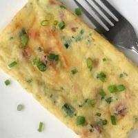 Crustless Quiche Lorraine Bite · The classic quiche made with wood smoked bacon, Swiss cheese, heavy cream and green onion. G...