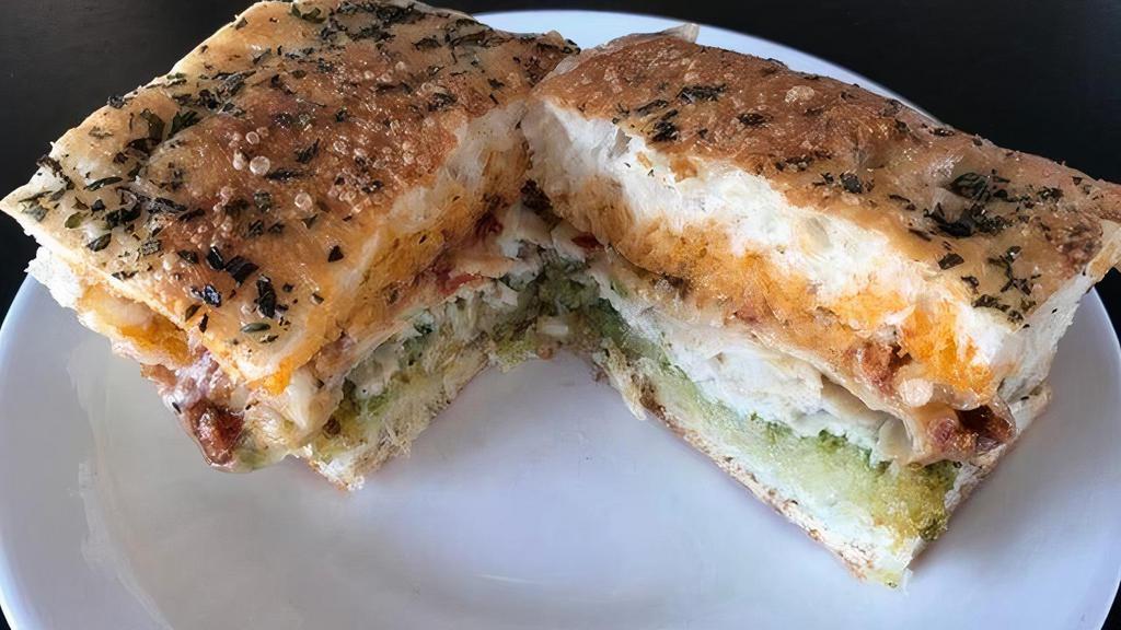 Turkey Pesto On Focaccia Bread · Made with Macrina Herbed Focaccia bread, basil pesto, tomato pesto mayo, Havarti cheese and thick sliced turkey. Fulfilling and super tasty!