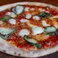 Margherita Pizza · pizza sauce, fresh mozzarella, basil, parmesan, olive oil