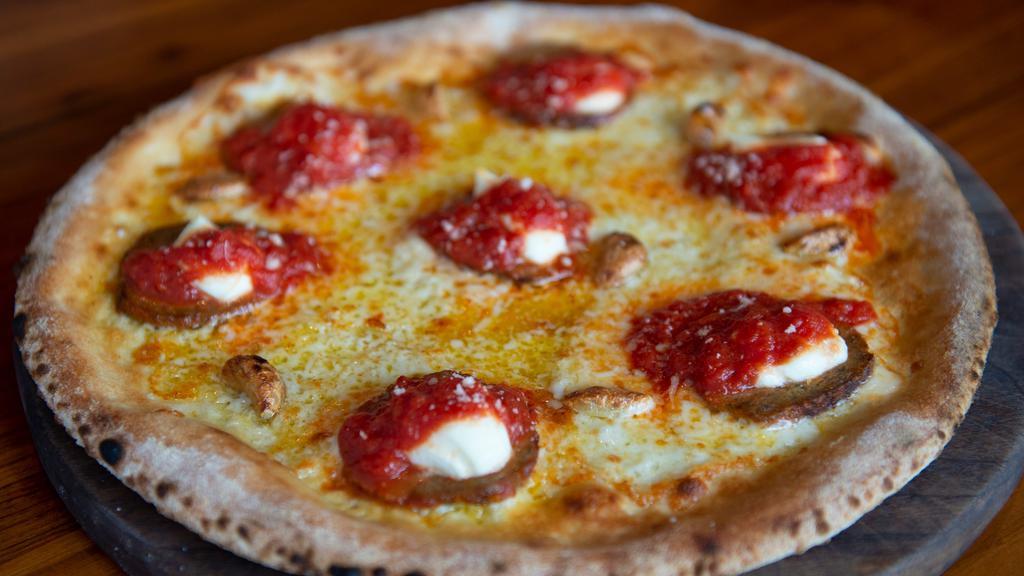 Comet Pizza · garlic herb oil, mozzarella, provolone, meatball, roasted garlic, ricotta, topped with red sauce