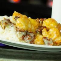 Honey Walnut Shrimp · Tossed in a sweet, creamy sauce, and served with caramelized candied walnuts.
