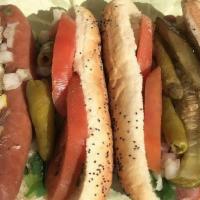 Chicago Style Hot Dog · The dog that put Chicago on the map! We start with a real Vienna Beef hot dog and “drag it t...
