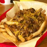 Veggie Chili Cheese Fries · We start with our hand-cut fries, smother them in our vegetarian chili and top them with shr...