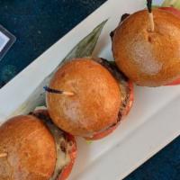 Kobe Beef Sliders · Snake River Farms Kobe ground beef patties on toasted brioche buns with melted cheddar chees...