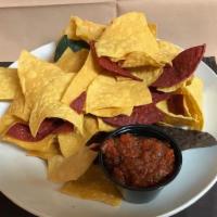 Chips & Salsa · Served with salsa roja.