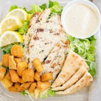 Grilled Chicken Caesar Salad · Another classic! 5oz. Grilled breast of chicken, Parmesan cheese and caesar dressing. Hand-t...