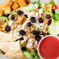Raspberry Chicken Salad · 5oz. grilled breast of chicken, Blue Cheese crumbles, walnuts, cherry tomato, cucumber, drie...