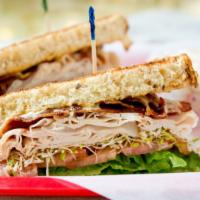 Santa Fe Club (Sandwich) · Oven classic turkey, bacon, avocado, lettuce, tomato, alfalfa sprouts and chipotle mayo. Ser...