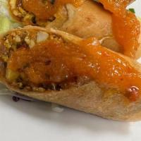 Crispy Paneer Rolls · Hand-rolled, carrots green onions, cabbage & bell-peppers.