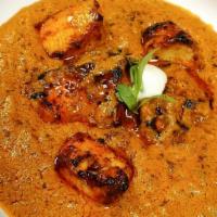 Chicken Tikka Masala · Creamy Onion and tomato gravy with clay roasted chicken.