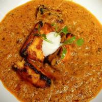 Paneer Tikka Masala · Creamy Onion and tomato gravy with clay roasted paneer.