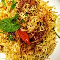 Chicken Biryani · Dum rice cooked wonderfully in low flame with chicken infusions of various spices.