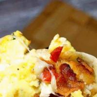 Breakfast Burrito · Country potatoes, caramelized onions, scrambled eggs, cheddar cheese, choice of meat, rolled...