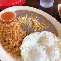 Huevos Rancheros · Popular item. Rice, beans, cheese, three eggs cooked option, ranchera salsa, tortilla corn o...