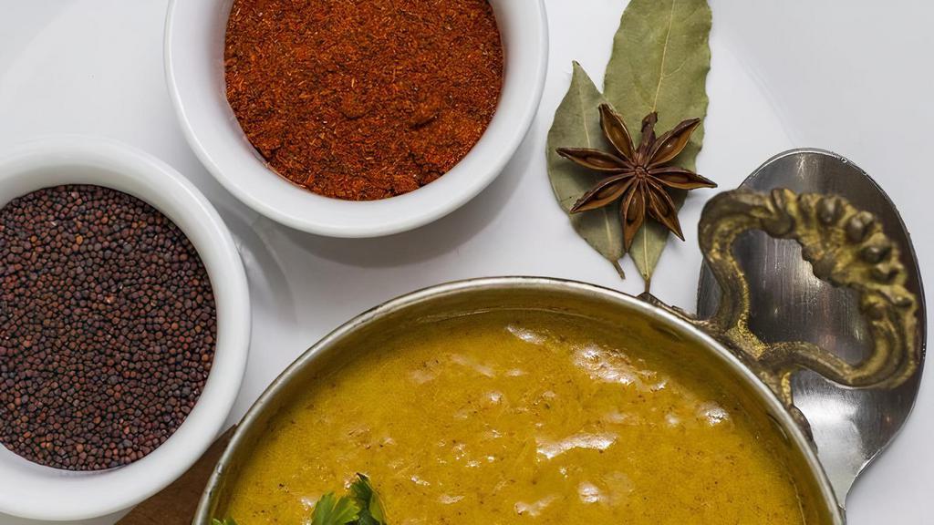 Madras Curry Bowl (Vegan) · Rich coconut milk collides with a rush of coriander and a robust spice blend.