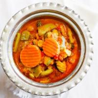 Makhini Curry Bowl · Buttery rich tomato based curry touched with fenugreek leaves and a discrete blend of spices.