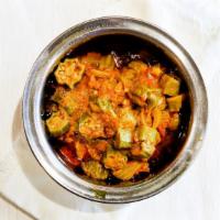 Bhindi Masala · Okra cooked with onions, tomatoes, and spices.