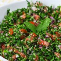 Tabbouleh · Finely chopped parsley, green onions & tomatoes mixed with bur gul wheat seasoned with lemon...