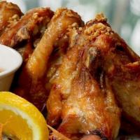 Crispy Garlic Wings. · Four jumbo sized chicken wings marinated with fresh garlic and spices.  Deep fried and . ser...
