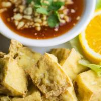 Fried Tofu. · Firm tofu deep-fried to a golden brown. Served with sweet chili sauce