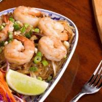 Phad Thai. · The most famous Thai dish.  Stir-fried thin rice noodles with egg, bean sprouts, onion and f...