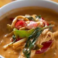 Red Curry. · Red curry cooked with coconut milk, bamboo shoots, sweet basil and bell pepper.