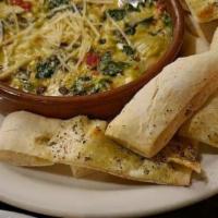 Spinach Artichoke Dip · Artichoke hearts, red peppers, green onion, spinach and cheeses.   Served with toasted focca...