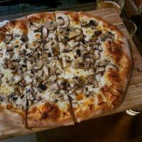 Truffle Tre Fungi Pizza · Portobello, crimini, button, and oyster mushrooms on olive oil base, topped with fresh orega...