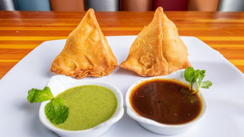 Samosa · Vegan, nut free. 2pieces of potatoes with green peas mildly seasoned with spices.