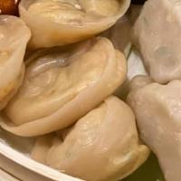 Steam Veg / Paneer / Chicken Momo · 8 pieces of Steamed Momos are bite-size dumplings with Veg/Paneer/Chicken filling, wrapped i...