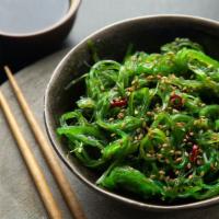 Seaweed Salad · Thinly sliced seaweed marinated in a light soy, sesame and rice vinegar dressing.