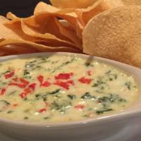 Espinaca Con Queso · Most popular, spicy. Creamy cheese dip spiced with jalapenos, spinach, onions, and peppers.