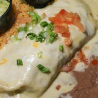 Burrito Jalisco · Steak or chicken seasoned with pico de gallo, topped with cream sauce, tomatoes, onions, gua...