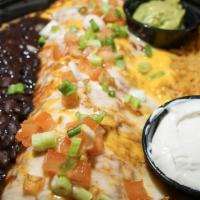 Burrito Tenampa · Filled with top sirloin and cooked with green peppers, mushrooms and onions. Topped with tom...