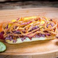 Brisket Dog. · 1/4 lb Beef Hot Dog, topped with Chopped Brisket, Smothered in Nacho Cheese and Onion Strings