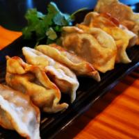 Pot Stickers (8 Pcs) · Hand-made Chinese dumplings served with special pot sticker sauce and hot oil.