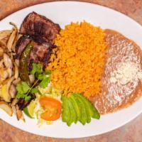 Carne Asada · Slice of skirt steak served with lettuce, tomatoes, green onions, chile jalapeno, rice, bean...